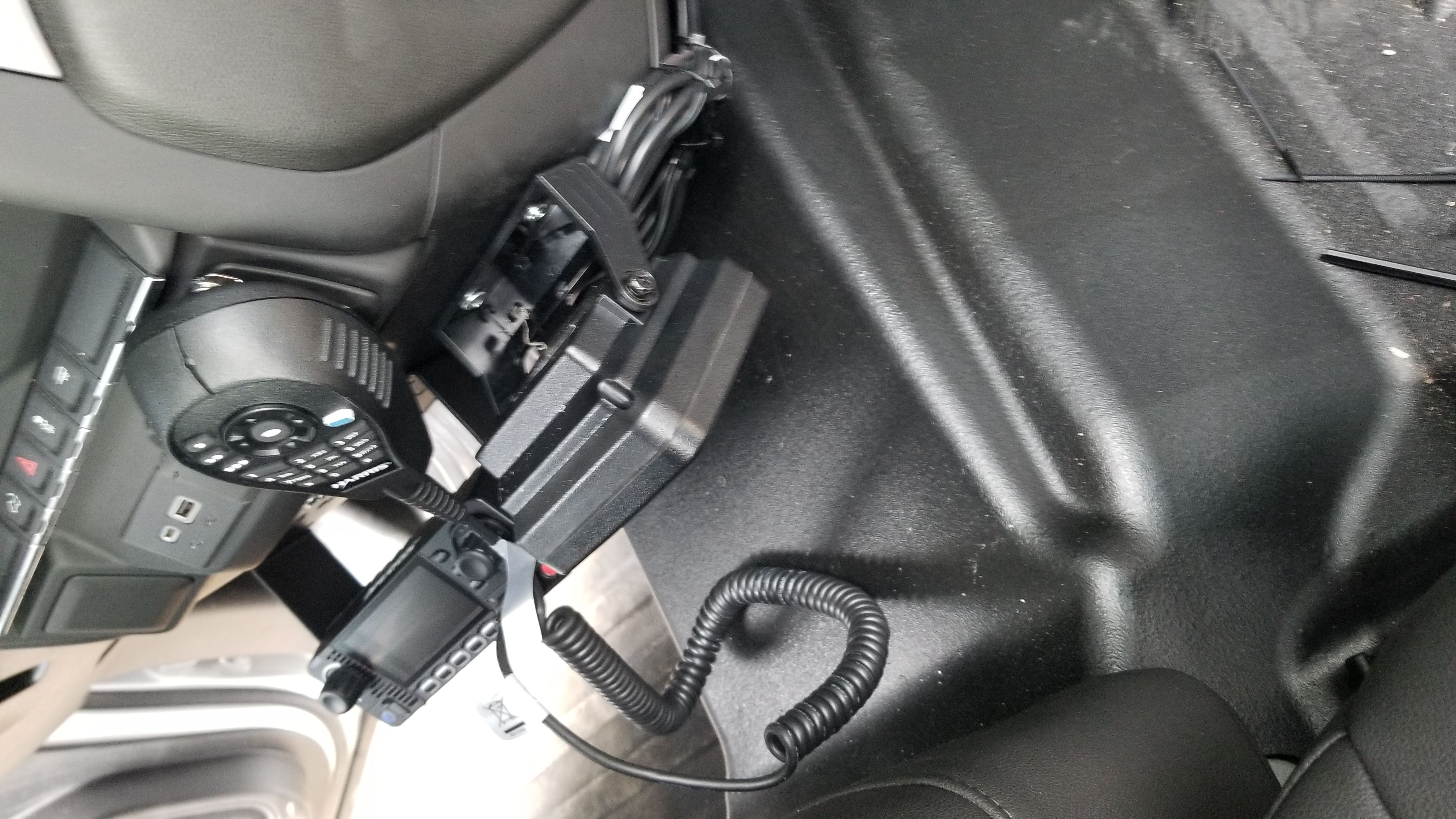 Mobile radio control head mounted near driver area